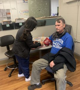 Community Participant having blood pressure checked at Human Health Fair @ WisCARES event