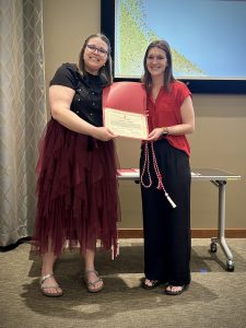 Claudia Miller being recognized as a UW IPE PoD Graduate.