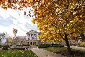 Pedestrians and students walk among the colors of the fall leaves near Bascom Hall at the University of Wisconsin-Madison during autumn on November 11, 2021. (Photo by Bryce Richter / UW-Madison)