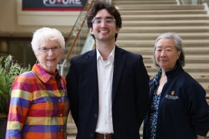Dr. Elaine Mischler, Ethan Elazegui, and Ruthanne Chun standing.