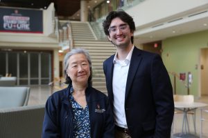 Two people standing.