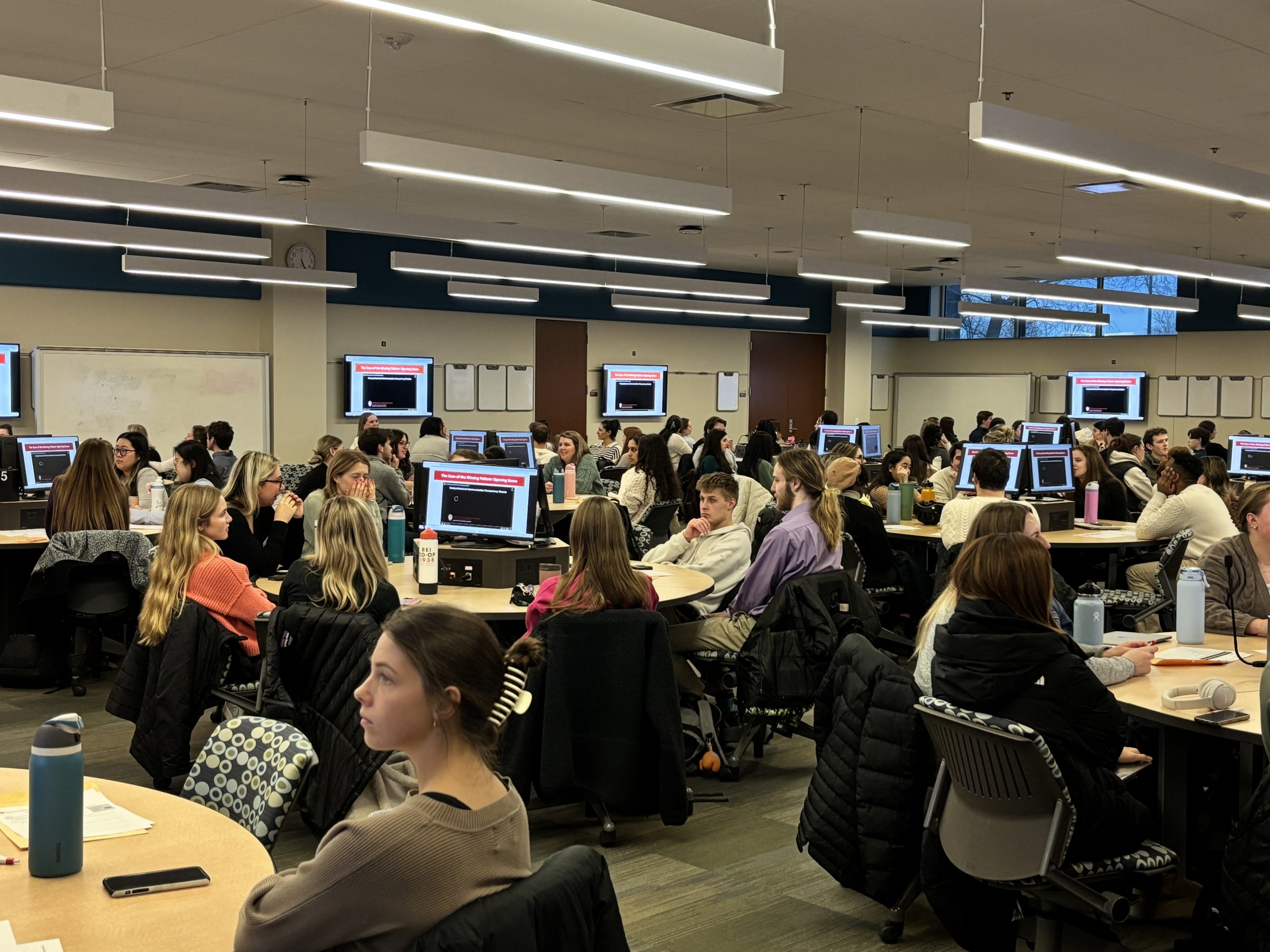 Students in large active learning room.
