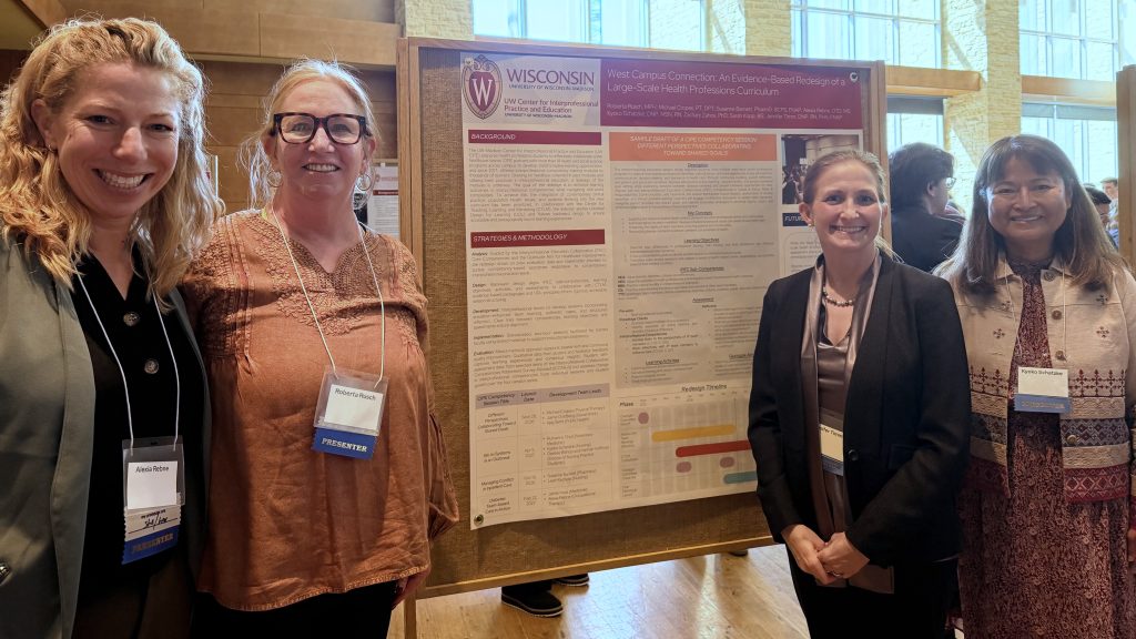 Four people presenting an academic poster at a conference. 